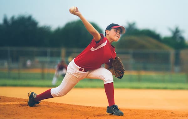 Youth baseball pitcher in the throwing motion